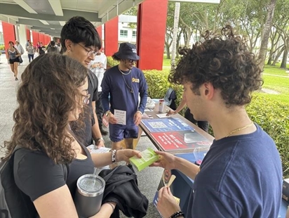 College students pass out Plan B to educate young voters at Florida Atlantic University on Thursday, April 11, 2024, in Boca Raton, Fla. Abortion and marijuana will be on Florida&#39;s November ballot, and these issues are critical issues for young voters.